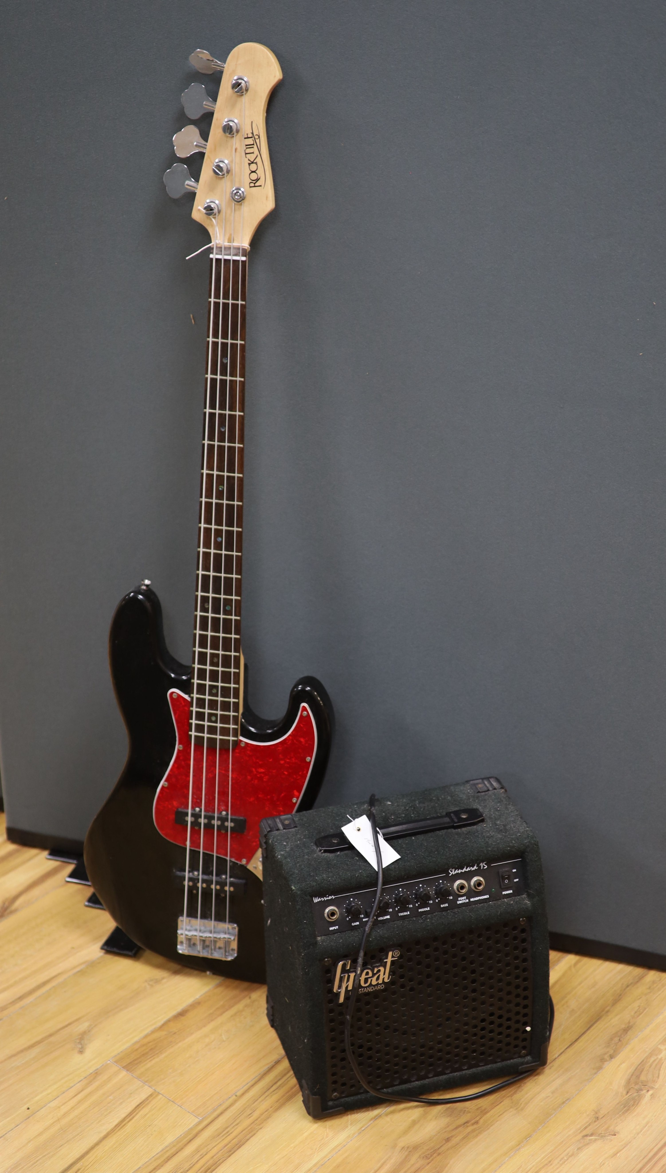 A Rock tile electric base guitar and a Great amplifier